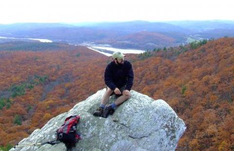 hiker sitting on rock