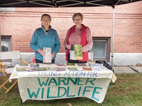 Members of the Warner cohort group table at a farmer's market