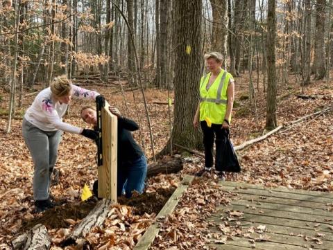 Straightening the signpost.  (L to R: Dawn Quirk, Jody Sloane, Barbara Marty)